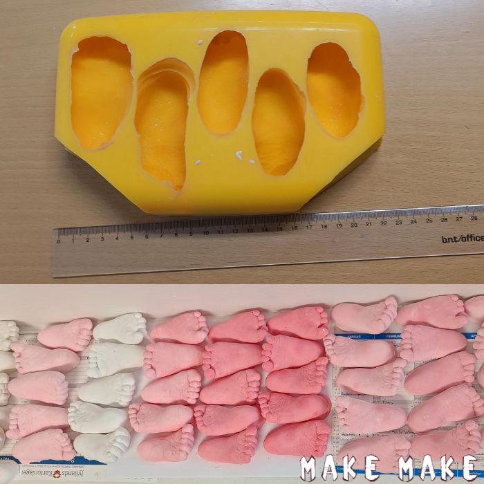 Silikoneform af babyfdder lavet i gips, samt en masse aftryk stbt deri, med gips indfarvet lyserd.