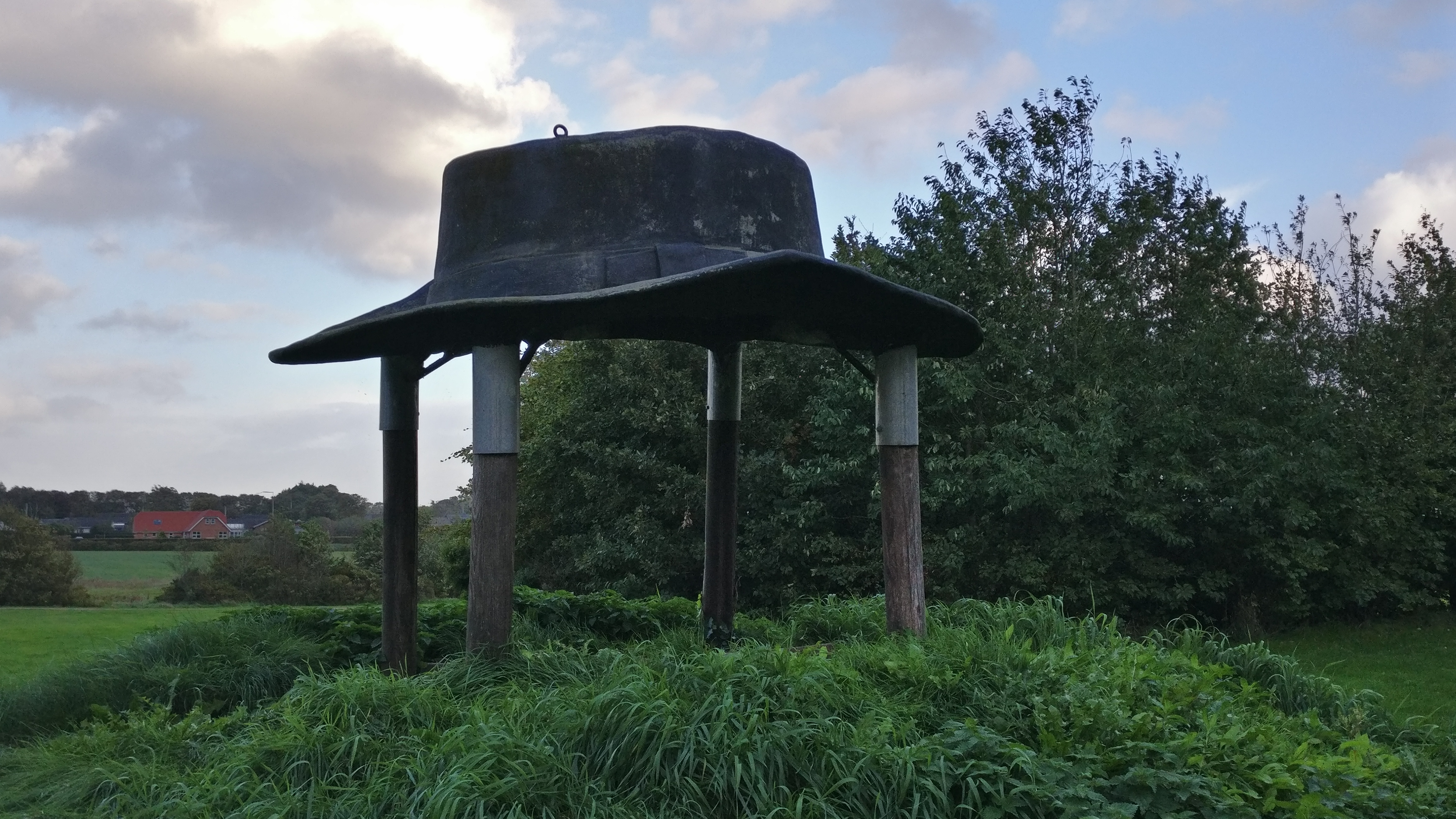 Big ConcreteClay hat monument placed on a small hill
