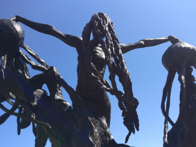 ConcreteClay sculpture of a woman swimming with jellyfish