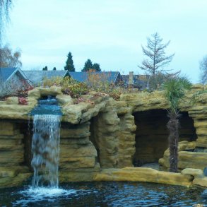 Cliffs and waterfall made in private garden with ConcreteClay.
